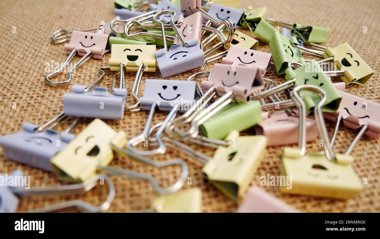 Pastel colored Office Paper Clips, Smiley Binder Clips, and Pencils on