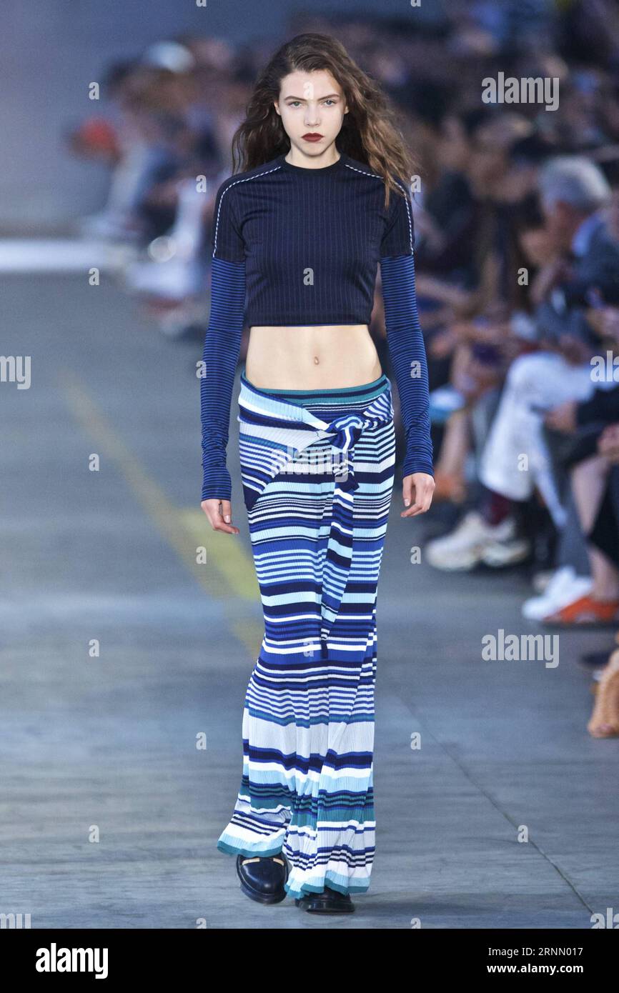 170618) -- MILAN, June 18, 2017 -- A model walks the runway during the  Men/Women show for fashion house Diesel Black Gold during Milan Men s  Fashion Week Spring/Summer 2018 in Milan,