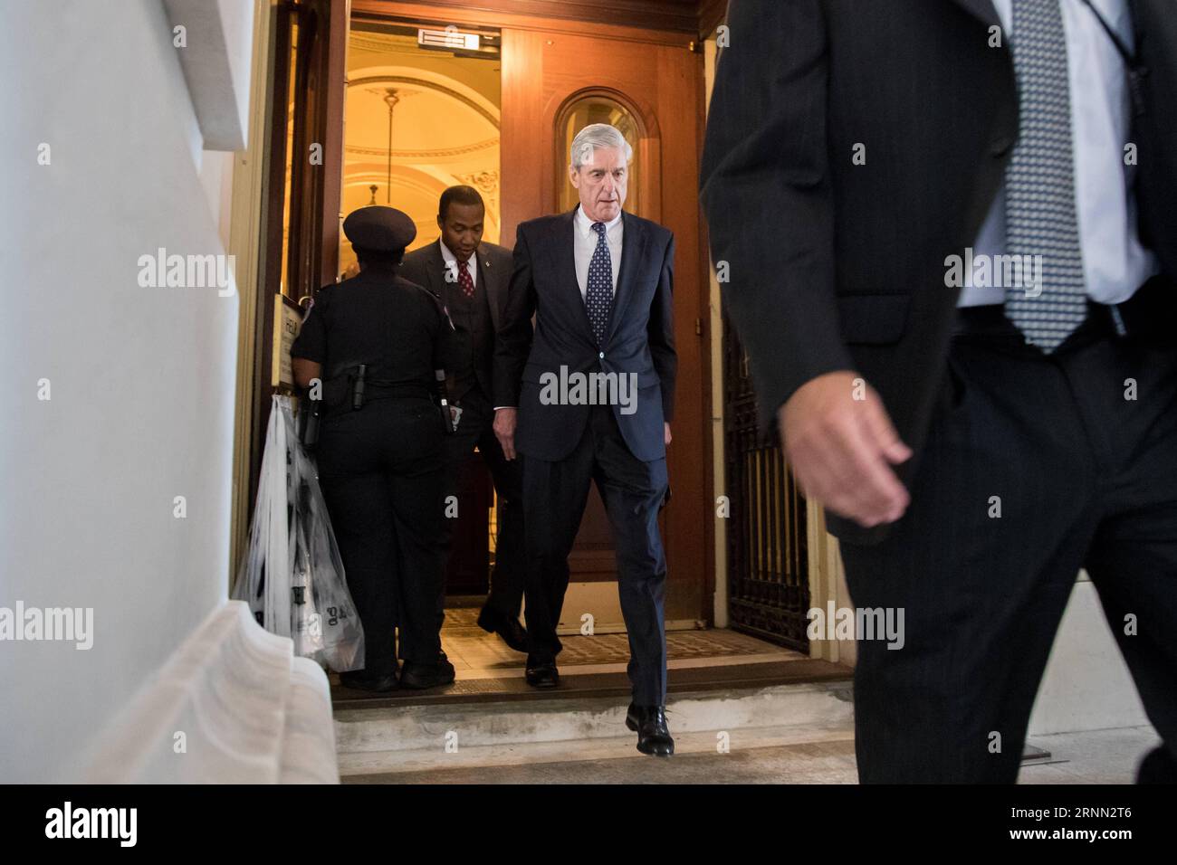 (170621) -- WASHINGTON, June 21, 2017 -- Former FBI Director Robert Mueller (C), the special counsel probing Russian interference in the 2016 U.S. election, leaves the Capitol building after meeting with the Senate Judiciary Committee on Capitol Hill in Washington D.C., the United States, on June 21, 2017. ) U.S.-WASHINGTON D.C.-CAPITOL-MUELLER TingxShen PUBLICATIONxNOTxINxCHN   Washington June 21 2017 Former FBI Director Robert Mueller C The Special Counsel probing Russian interference in The 2016 U S ELECTION Leaves The Capitol Building After Meeting With The Senate Judiciary Committee ON Ca Stock Photo