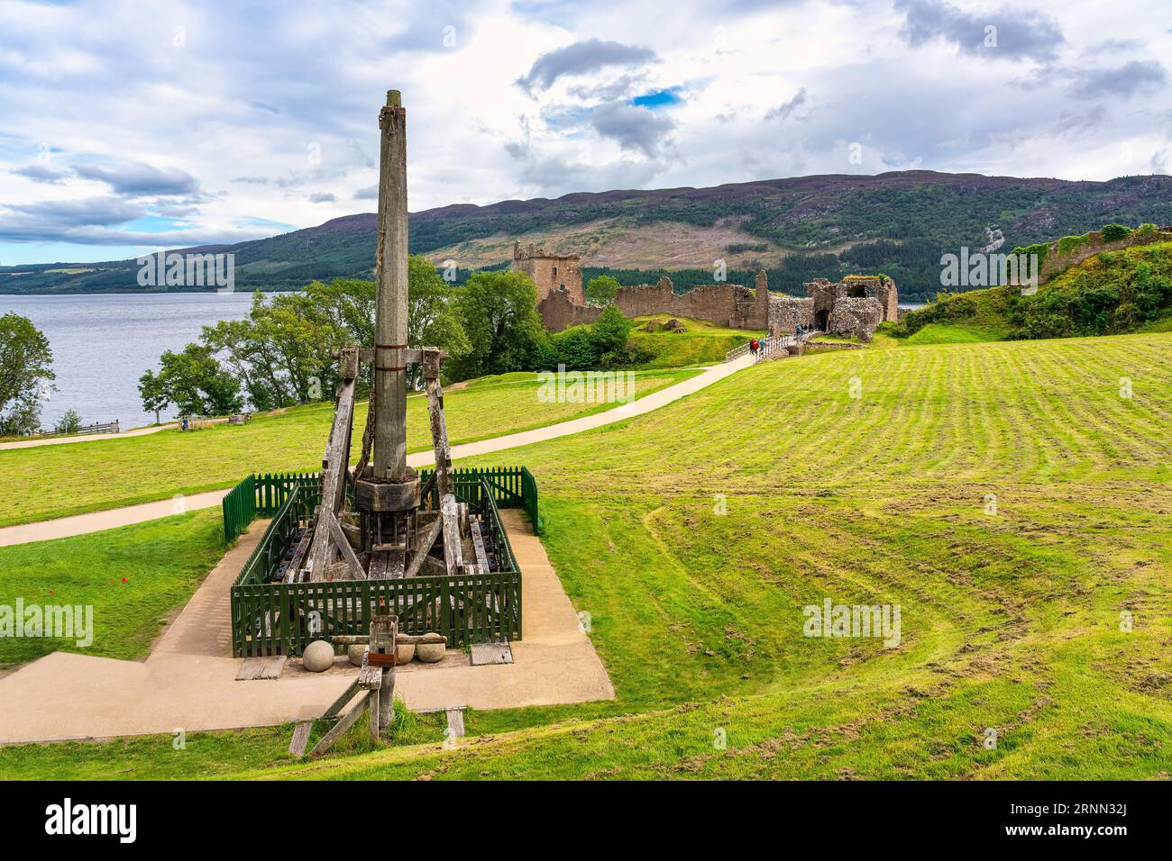 Urquhart Castle on Loch Ness with machines used in the Middle Ages to ...