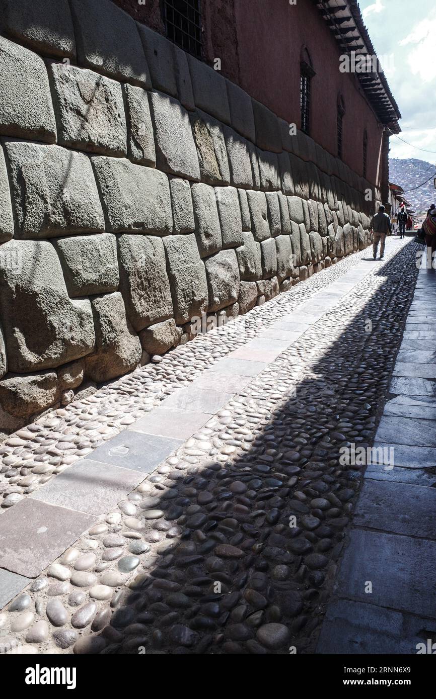 Cusco, Peru - Dec 5, 2022: Hatun Rumiyoc street with Incan twelve angle stone in Cusco, Peru Stock Photo