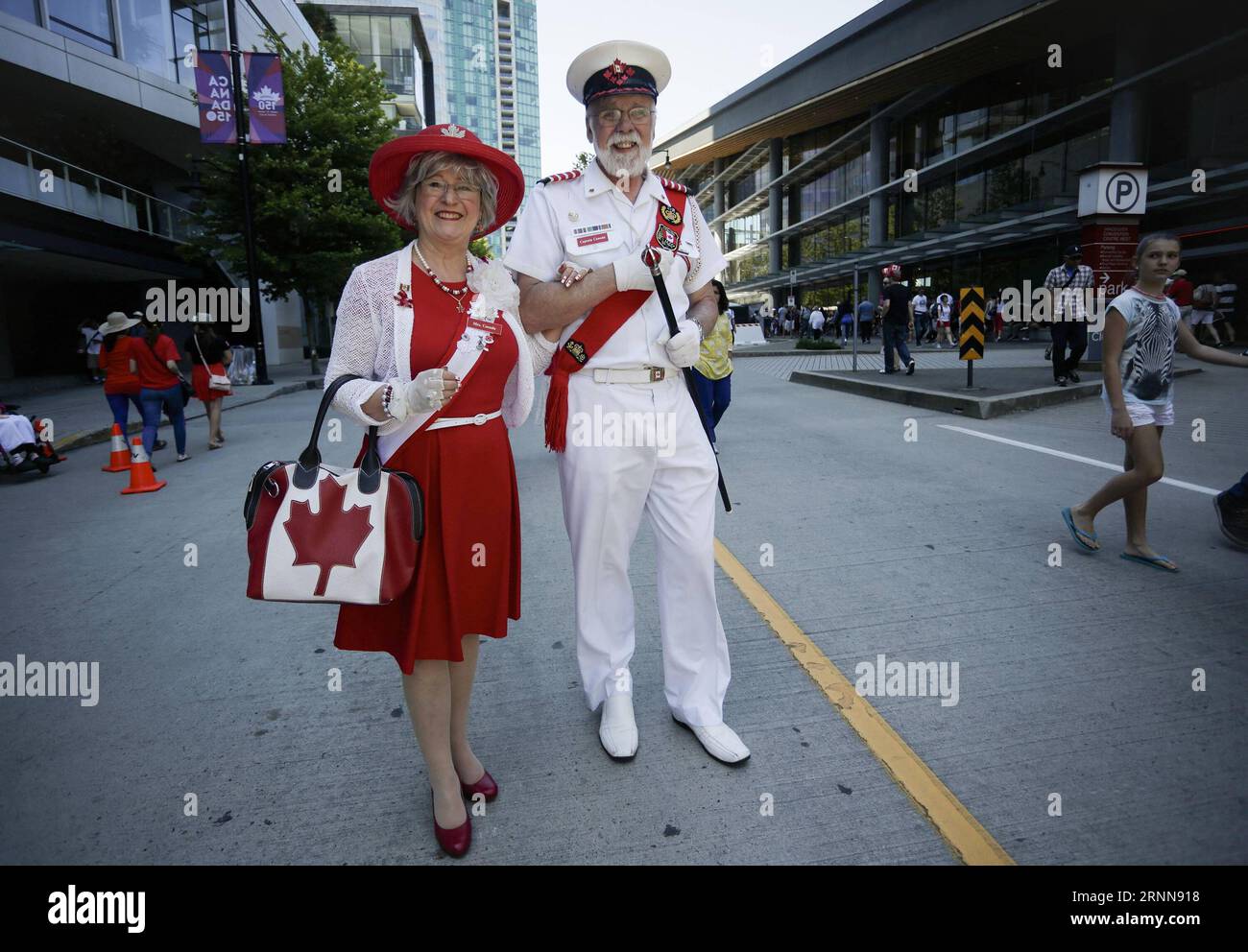 (170702) -- VANCOUVER, July 2, 2017 -- A couple wear patriotic outfits during the Canada Day celebration at Canada Place in Vancouver, Canada, July 1, 2017. People gathered at Canada Place in downtown Vancouver to celebrate the 150th anniversary of Canada on Saturday. ) (zxj) CANADA-VANCOUVER-CANADA DAY-CELEBRATION Liangxsen PUBLICATIONxNOTxINxCHN   Vancouver July 2 2017 a COUPLE Wear Patriotic Outfits during The Canada Day Celebration AT Canada Place in Vancouver Canada July 1 2017 Celebrities gathered AT Canada Place in Downtown Vancouver to Celebrate The 150th Anniversary of Canada ON Satur Stock Photo