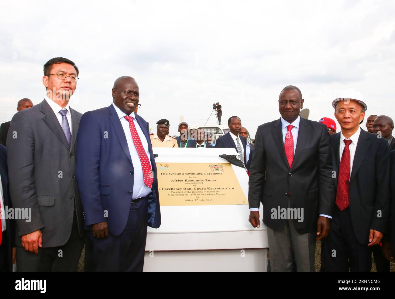 (170707) -- ELDORET(KENYA), July 7, 2017 -- Kenyan Deputy President William Ruto (2nd R, front), Counsellor of the Chinese Embassy in Kenya Yao Ming (1st L, front) and other guests unveil a commemorative plaque at the launching ceremony of the Special Economic Zone project in Eldoret, Kenya, on July 7, 2017. Kenya on Friday launched a Special Economic Zone (SEZ) project that is expected to attract about 2 billion U.S. dollars of foreign investments. The project is a joint venture between Kenyan-based company Africa Economic Zone and China s Guangdong New South Group. ) KENYA-ELDORET-SPECIAL EC Stock Photo