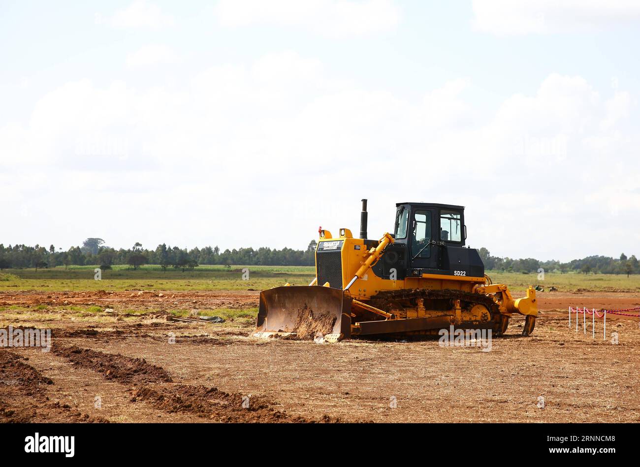 (170707) -- ELDORET(KENYA), July 7, 2017 -- A bulldozer is seen at the launching ceremony of the Special Economic Zone project in Eldoret, Kenya, on July 7, 2017. Kenya on Friday launched a Special Economic Zone (SEZ) project that is expected to attract about 2 billion U.S. dollars of foreign investments. The project is a joint venture between Kenyan-based company Africa Economic Zone and China s Guangdong New South Group. ) KENYA-ELDORET-SPECIAL ECONOMIC ZONE-LAUNCHING CEREMONY PanxSiwei PUBLICATIONxNOTxINxCHN   Eldoret Kenya July 7 2017 a Bulldozers IS Lakes AT The Launching Ceremony of The Stock Photo