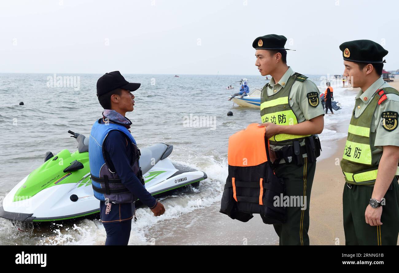 170713) -- DALIAN, July 13, 2017 -- A police officer tells a