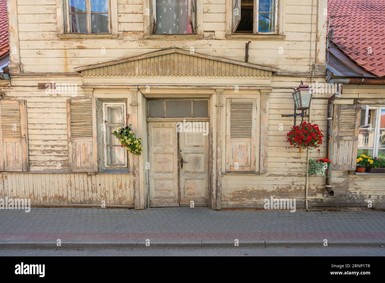 Wooden House Facade with flowers - Cesis, Latvia Stock Photo
