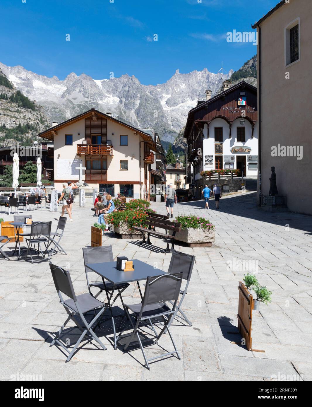 COURMAYEUR, ITALY - JULY 12, 2022: The Piazza Abbe Henry square and Grand Jorasses massif from Courmayeur - Aosta valley in Italy. Stock Photo