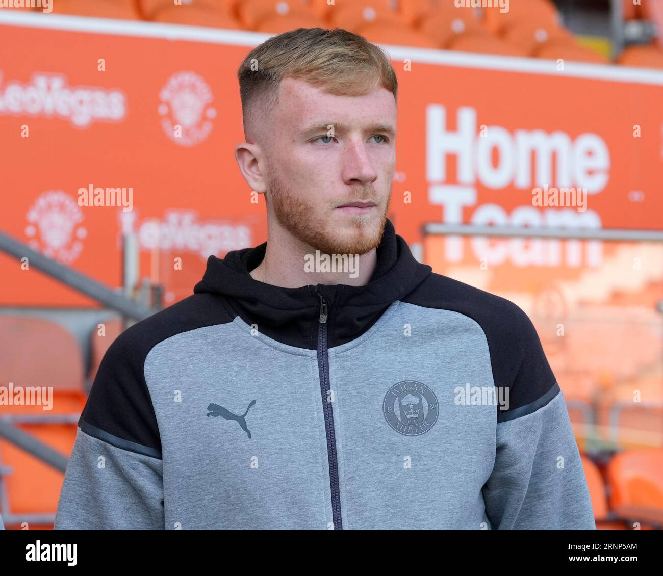 Liam Morrison 4 of Wigan Athletic inspects the pitch before the Sky
