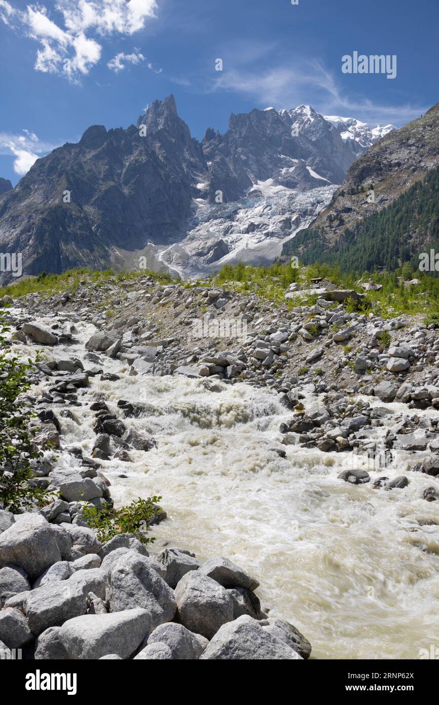 The Mont Blanc Massif with the glacial stream of Brenva glacier over the Entreves - Italy. Stock Photo