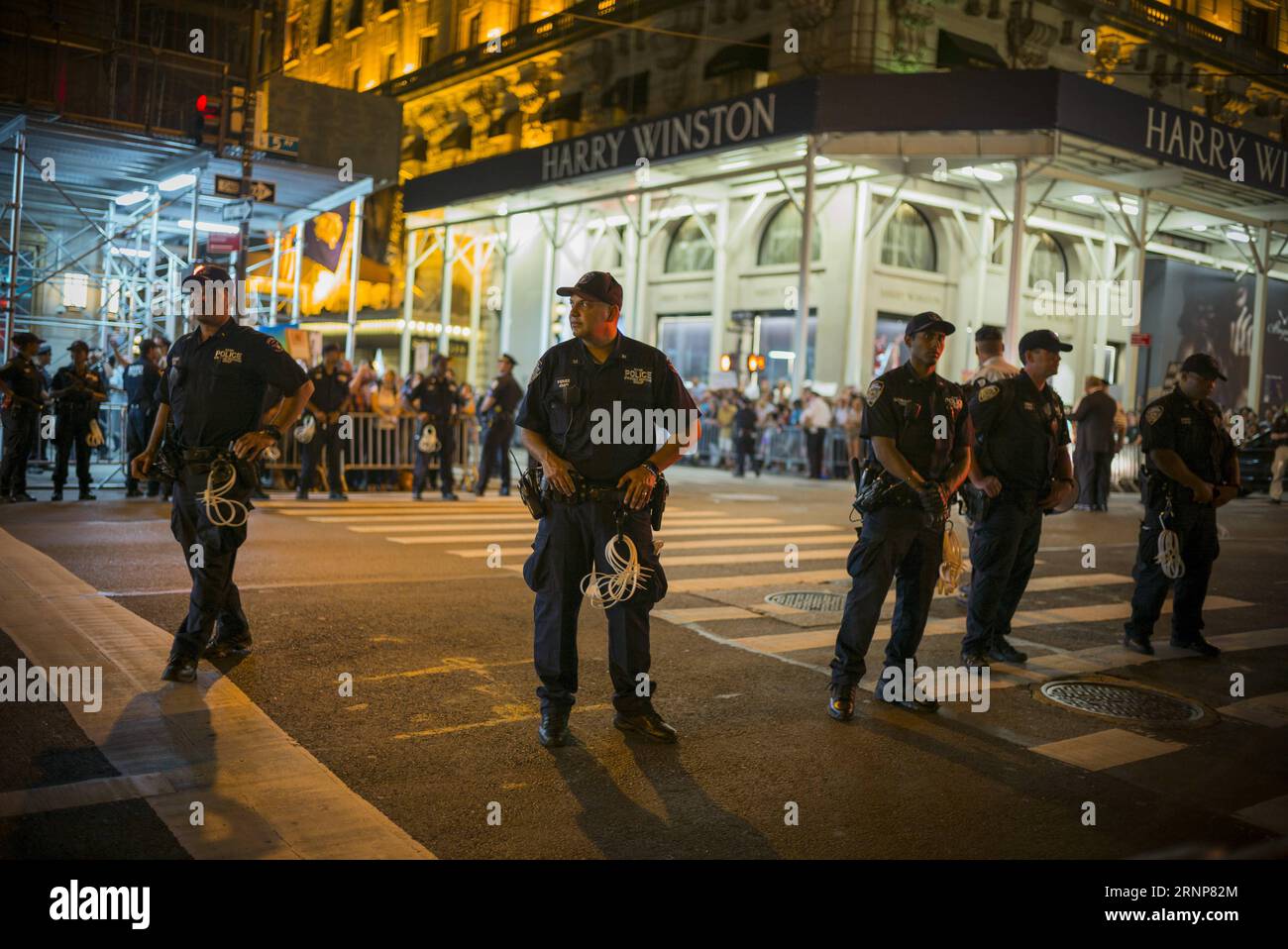 (170815) -- NEW YORK, Aug. 15, 2017 -- Police stand guard during a protest outside the Trump Tower in New York, the United States, Aug. 14, 2017. Thousands of protesters crowded the streets around Trump Tower before U.S. President Donald Trump s first visit to the building since taking office on Monday. ) (jmmn) U.S.-NEW YORK-PROTEST-TRUMP LixMuzi PUBLICATIONxNOTxINxCHN   170815 New York Aug 15 2017 Police stand Guard during a Protest outside The Trump Tower in New York The United States Aug 14 2017 thousands of protesters crowded The Streets Around Trump Tower Before U S President Donald Trum Stock Photo