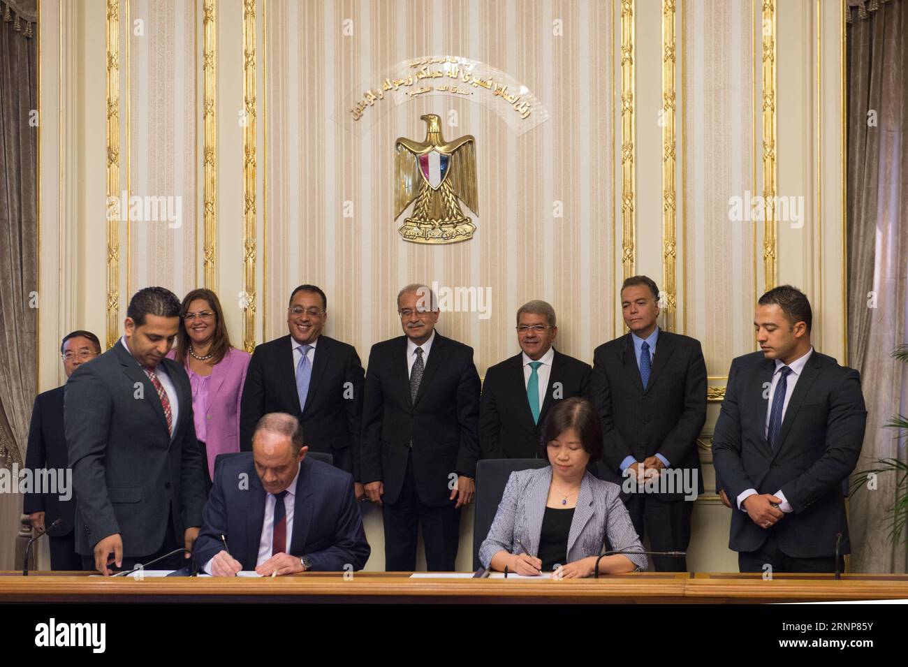 (170815) -- CAIRO, Aug. 15, 2017 -- Egyptian Prime Minister Sherif Ismail (4th R, Rear) attends the signing ceremony between Egypt s National Authority for Tunnels (NAT) and the joint coalition of China s AVIC International and China Railway Group Limited in Cairo, Egypt, on Aug. 15, 2017. The Egyptian Ministry of Transport and a coalition of Chinese firms signed on Tuesday an agreement worth 1.24 billion U.S. dollars to build a light rail transit in new districts around Cairo. ) EGYPT-CAIRO-CHINA-LIGHT RAIL-DEAL MengxTao PUBLICATIONxNOTxINxCHN   170815 Cairo Aug 15 2017 Egyptian Prime Ministe Stock Photo