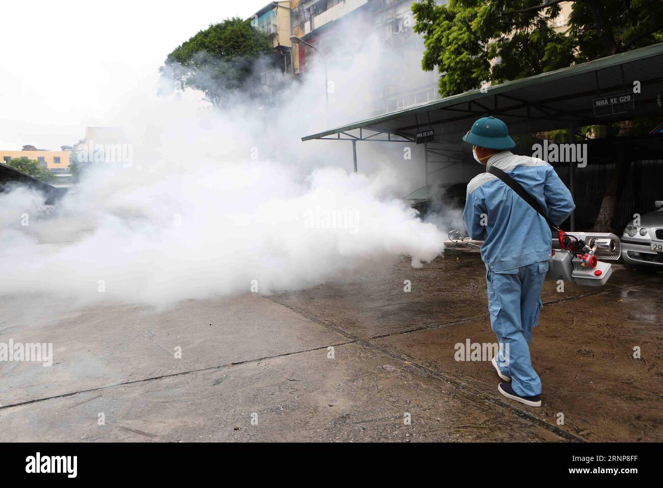 170816-hanoi-aug-16-2017-a-worker-sprays-insecticides-in