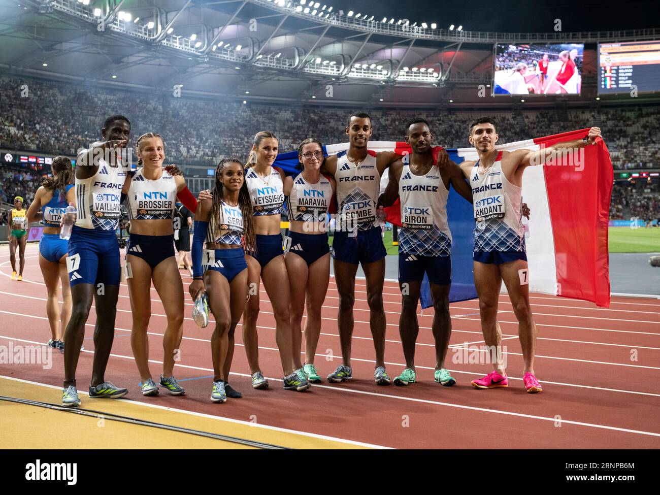 Team france men's and women celebrate after competing in the 4x400m