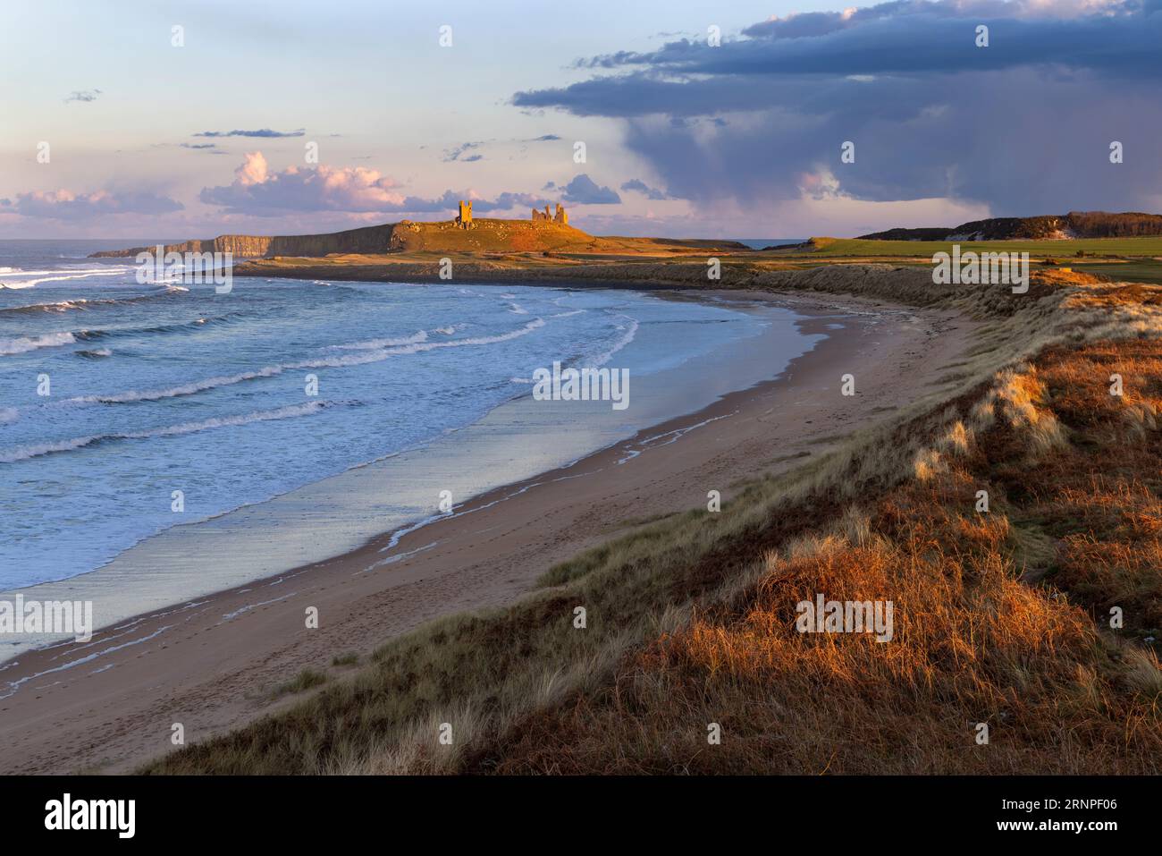 Dunstanburgh Castle and Embleton Bay, Northumberland, UK Stock Photo