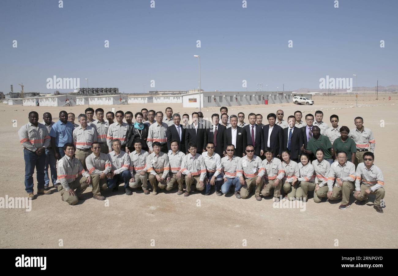 (170829) -- WINDHOEK, Aug. 29, 2017 -- Chinese Vice Premier Zhang Gaoli (C) poses for a group photo with Chinese and Namibian workers while visiting Husab Uranium Mine, a Chinese-invested project, in Namibia, Aug. 27, 2017. ) (ry) NAMIBIA-CHINA-VICE PREMIER-VISIT GaoxJie PUBLICATIONxNOTxINxCHN   Windhoek Aug 29 2017 Chinese Vice Premier Zhang Gaoli C Poses for a Group Photo With Chinese and Namibian Workers while Visiting  Uranium Mine a Chinese Invested Project in Namibia Aug 27 2017 Ry Namibia China Vice Premier Visit GaoxJie PUBLICATIONxNOTxINxCHN Stock Photo