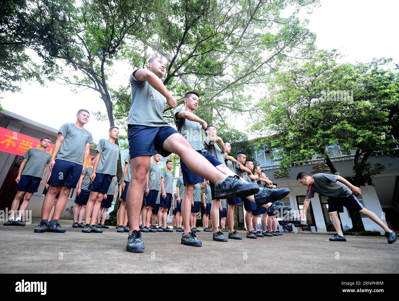 (170830) -- LIUZHOU, Aug. 30, 2017 -- Deng Feng takes part in a training for joining the army in Liuzhou, south China s Guangxi Zhuang Autonomous Region, Aug. 30, 2017. Deng, 24, who just graduated from Xingjian College of Science and Liberal Arts of Guangxi University, has signed for the army twice. When he was a freshman, Deng Feng was for the first time recruited as a soldier of Guangxi Frontier Corps of Chinese Armed Police and was on service for two years. Deng Feng then left army and went back to Guangxi University until he finished his study. Upon graduation, however, Deng Feng again de Stock Photo