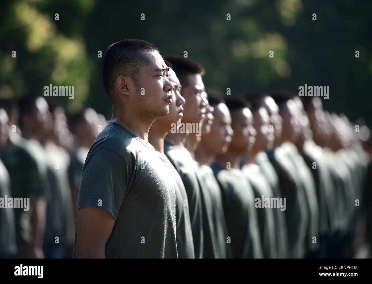 (170830) -- LIUZHOU, Aug. 30, 2017 -- Deng Feng (front) takes part in a training for joining the army in Liuzhou, south China s Guangxi Zhuang Autonomous Region, Aug. 30, 2017. Deng, 24, who just graduated from Xingjian College of Science and Liberal Arts of Guangxi University, has signed for the army twice. When he was a freshman, Deng Feng was for the first time recruited as a soldier of Guangxi Frontier Corps of Chinese Armed Police and was on service for two years. Deng Feng then left army and went back to Guangxi University until he finished his study. Upon graduation, however, Deng Feng Stock Photo