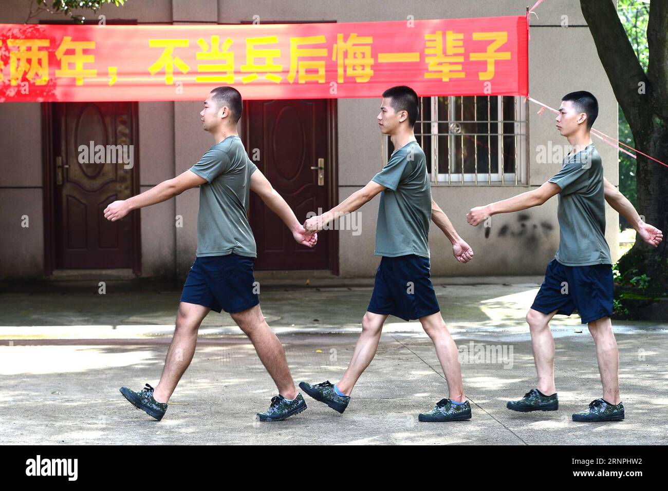 (170830) -- LIUZHOU, Aug. 30, 2017 -- Deng Feng (1st L) takes part in a training for joining the army in Liuzhou, south China s Guangxi Zhuang Autonomous Region, Aug. 30, 2017. Deng, 24, who just graduated from Xingjian College of Science and Liberal Arts of Guangxi University, has signed for the army twice. When he was a freshman, Deng Feng was for the first time recruited as a soldier of Guangxi Frontier Corps of Chinese Armed Police and was on service for two years. Deng Feng then left army and went back to Guangxi University until he finished his study. Upon graduation, however, Deng Feng Stock Photo