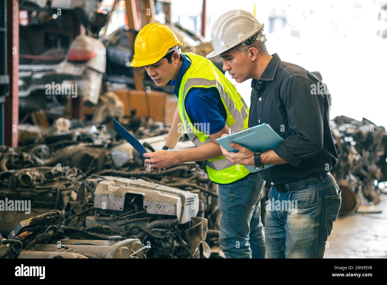 Senior engineer team check inventory store old used auto spare part