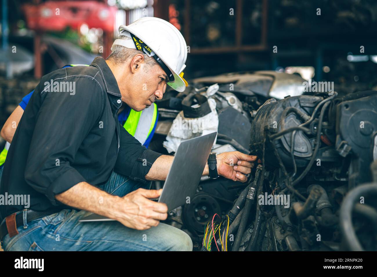 Senior engineer team check inventory store old used auto spare part