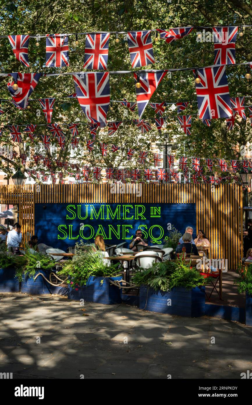 London, UK Sloane Square in Chelsea, London. An open air bar in the