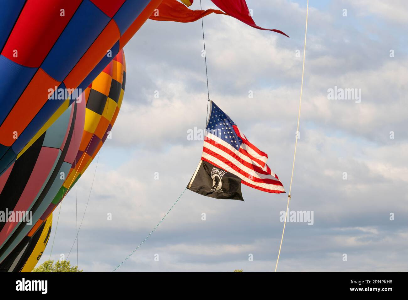 Closeup of hot air balloons flying the American flag and POW-MIA flag Stock Photo