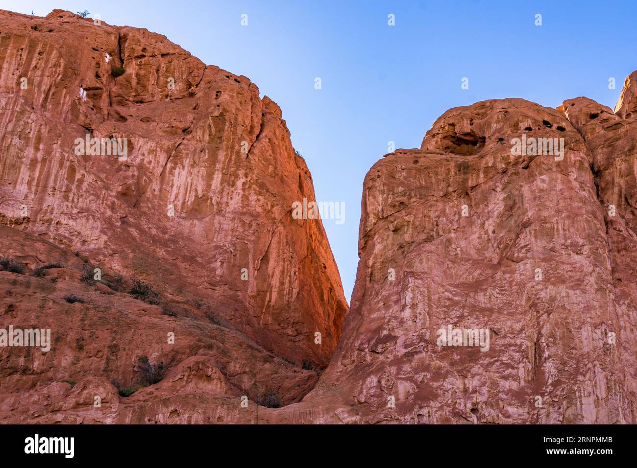 A stunning landscape featuring two large rocks facing each other by the ...