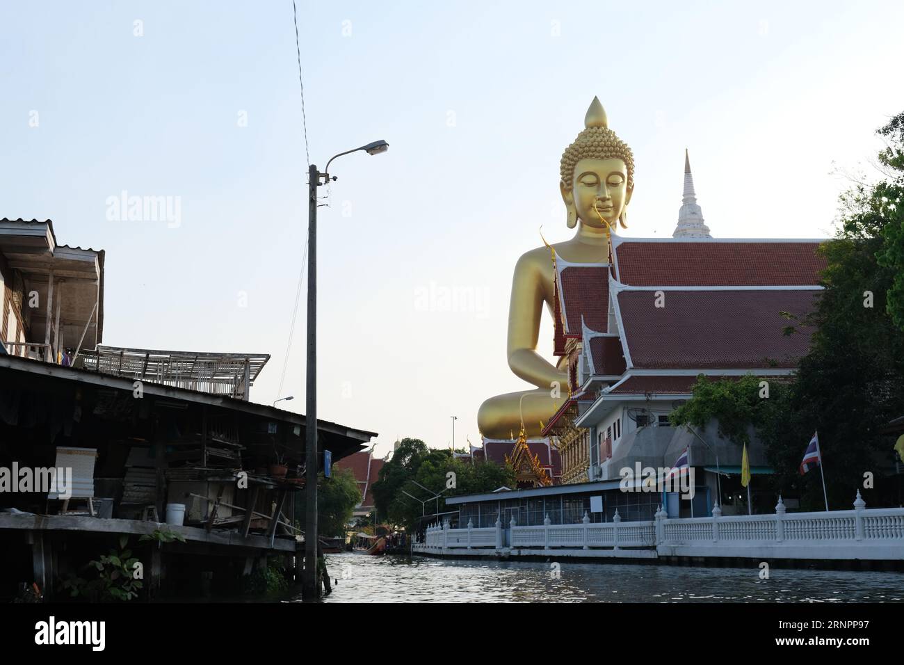 Huge golden Buddha statue at Wat Paknam Pasi Charoen in western Bangkok Stock Photo