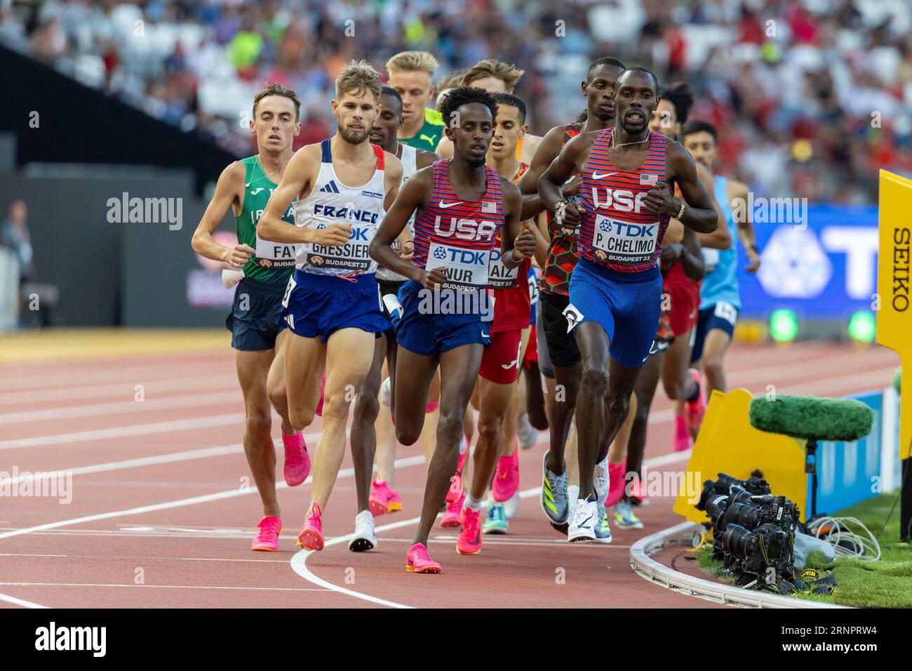 Abdihamid Nur (USA) and Paul Chelimo (USA) lead the 5000 meters during