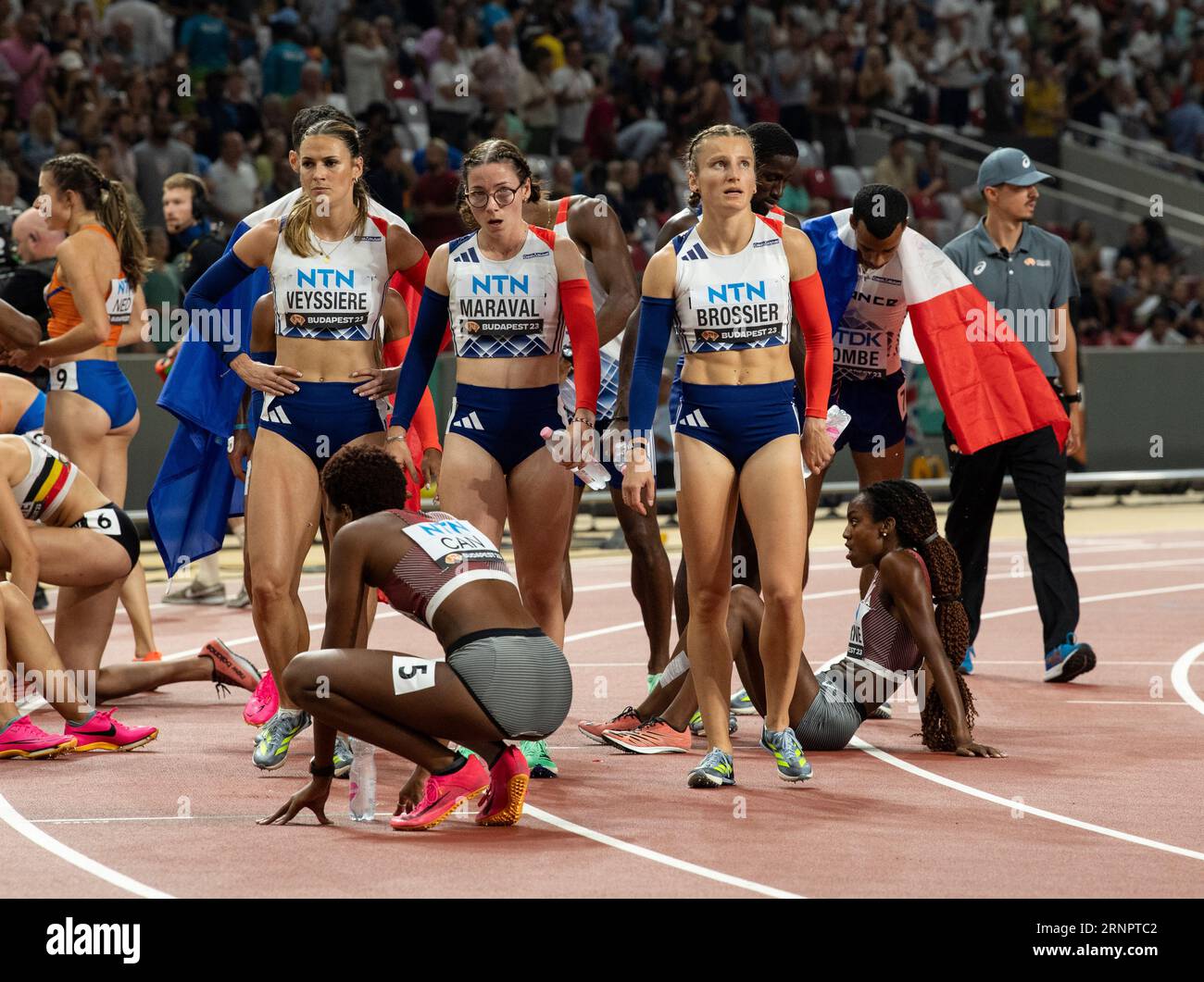 Team France celebrate after competing in the women’s 4x400m relay final