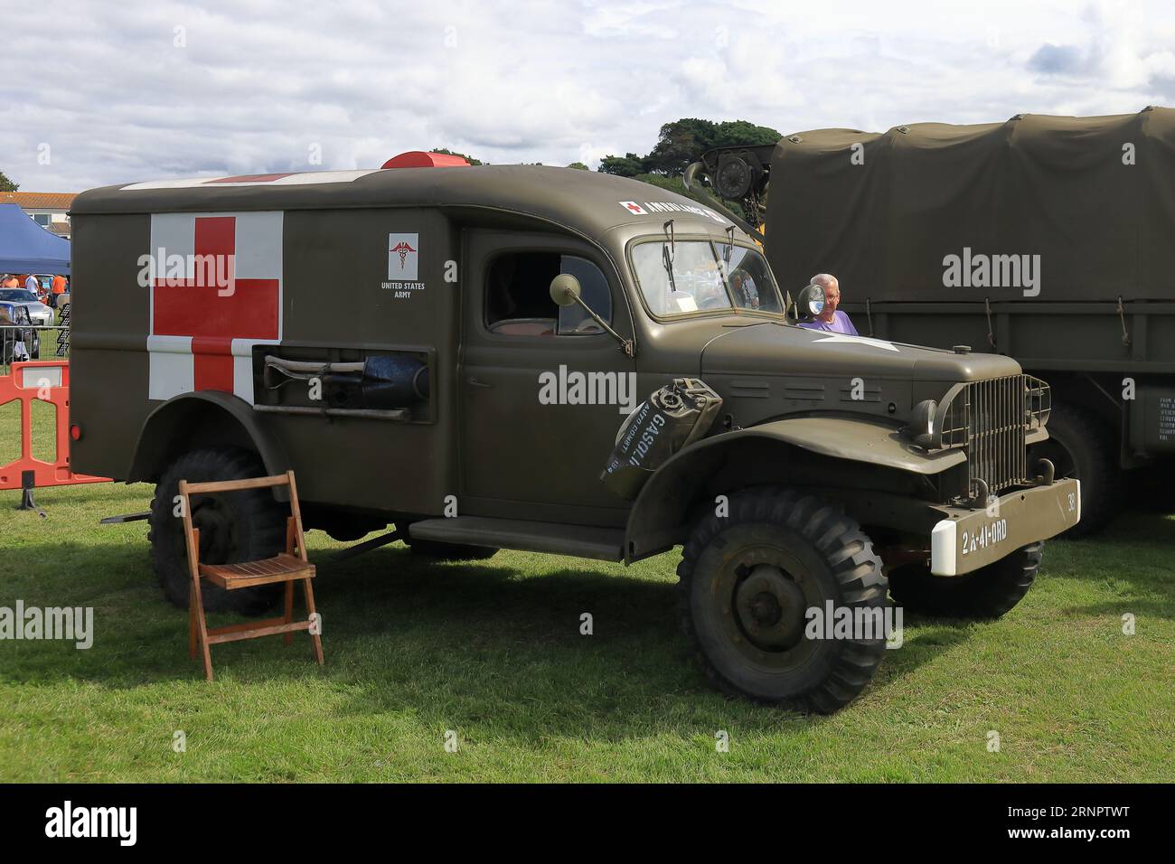 A US army Dodge WC-54 ambulance on display, c1940s. The Gosport Car Rally is organised by the local Rotary Club and takes place at Stokes Bay on the August bank holiday Monday. This year's event, providing a cheap family day out, was the seventieth and hosted vintage cars and motorbikes, a petting farm, stalls, refreshments and an arena which provided various forms of entertainment. Stock Photo