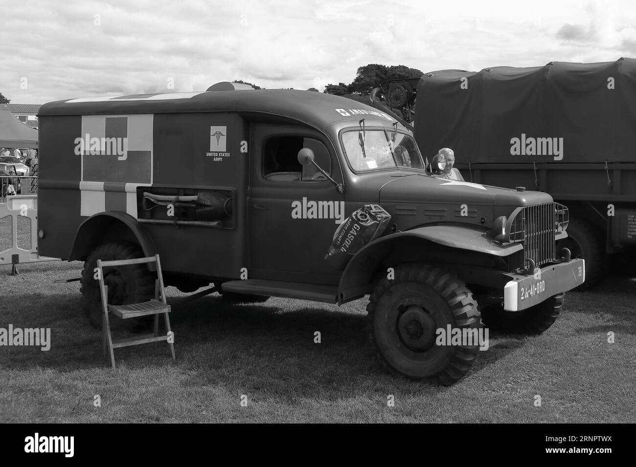 Black and white: A US army Dodge WC-54 ambulance on display, c1940s. The Gosport Car Rally is organised by the local Rotary Club and takes place at Stokes Bay on the August bank holiday Monday. This year's event, providing a cheap family day out, was the seventieth and hosted vintage cars and motorbikes, a petting farm, stalls, refreshments and an arena which provided various forms of entertainment. Stock Photo