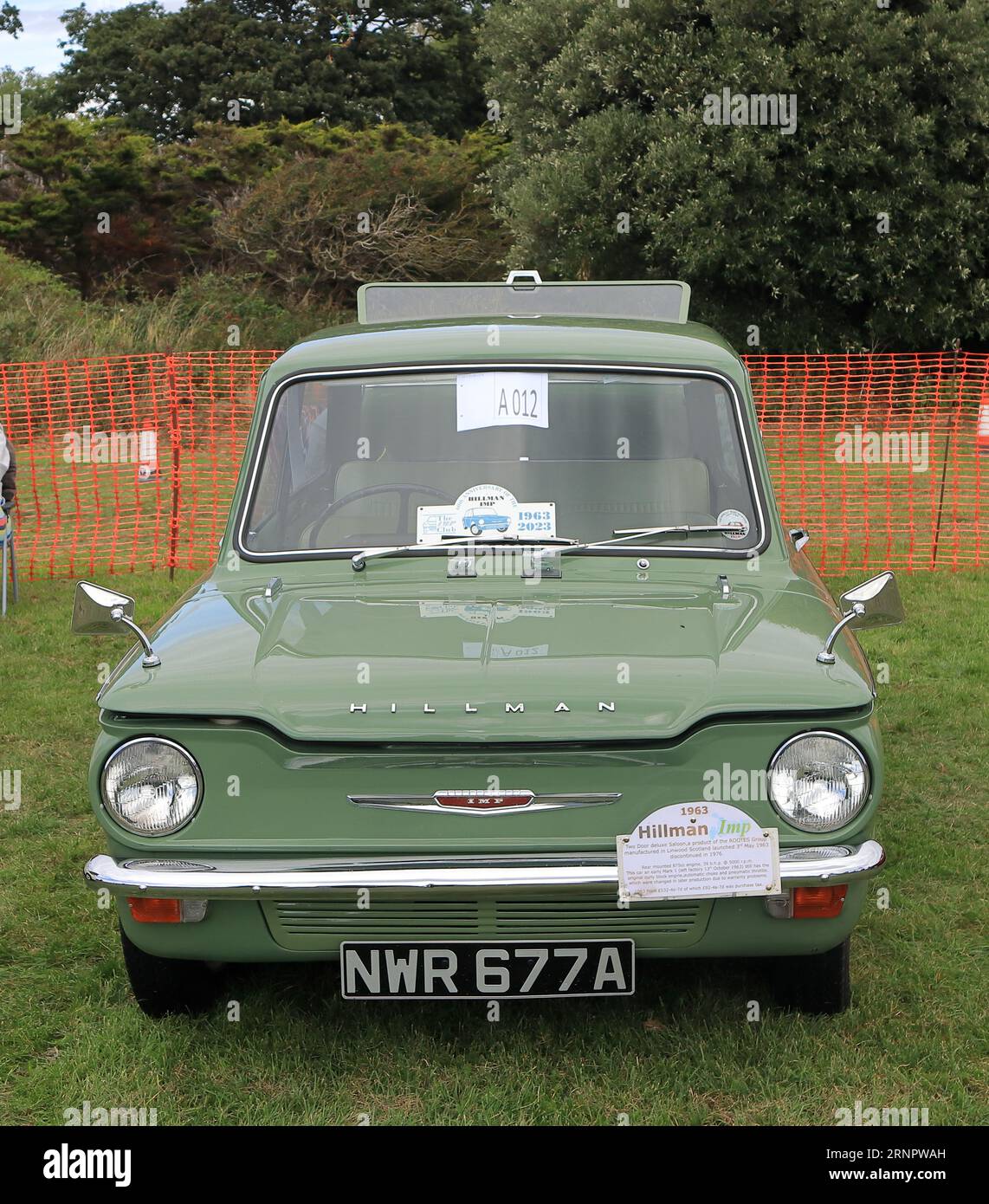 1963 green Hillman Imp motor car on display. The Gosport Car Rally is organised by the local Rotary Club and takes place at Stokes Bay on the August bank holiday Monday. This year's event, providing a cheap family day out, was the seventieth and hosted vintage cars and motorbikes, a petting farm, stalls, refreshments and an arena which provided various forms of entertainment. Stock Photo