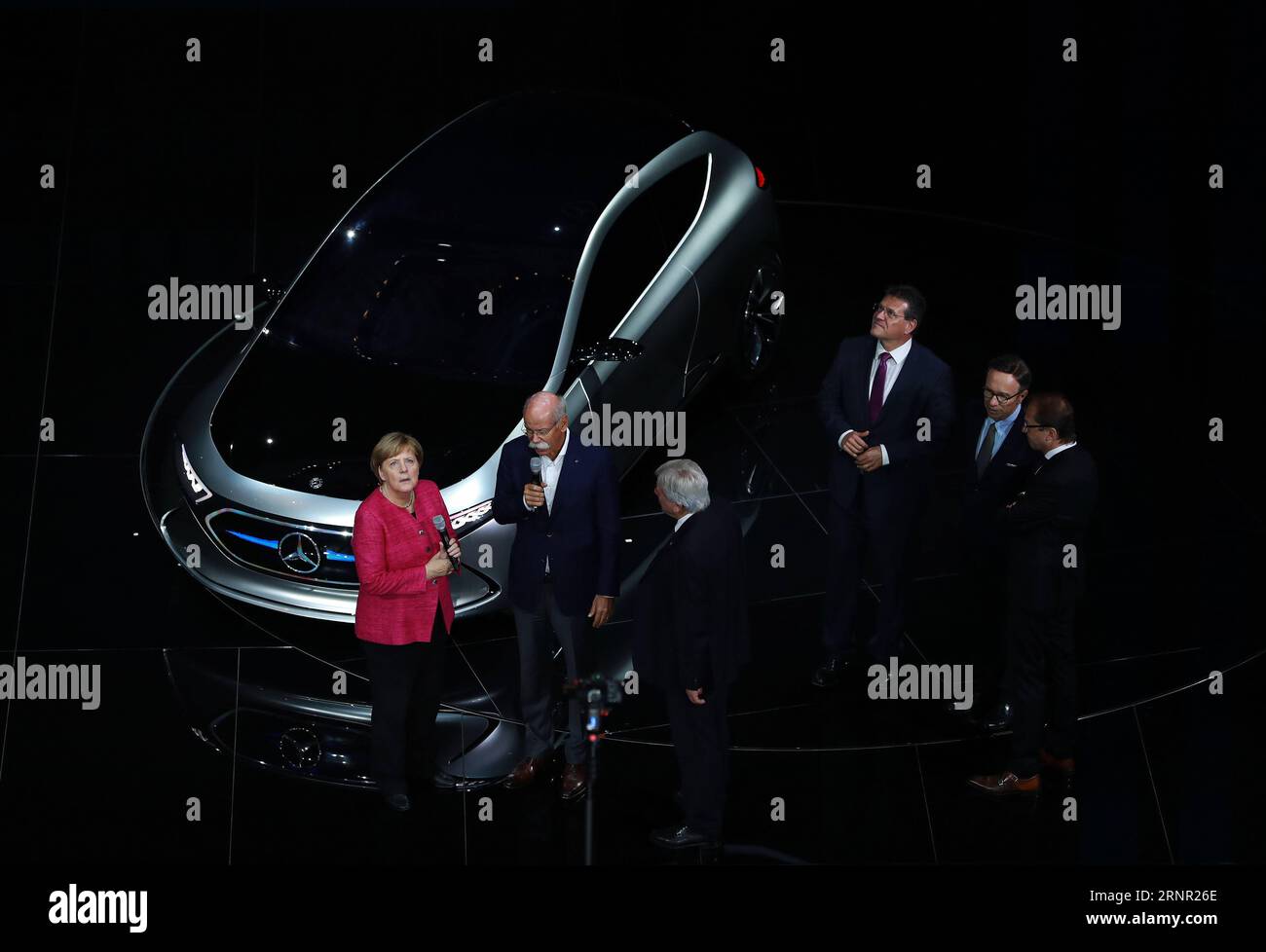 (170914) -- FRANKFURT, Sep. 14, 2017 -- German Chancellor Angela Merkel (1st L) listens to Dieter Zetsche (2nd L), chairman of German car maker Daimler AG and head of Mercedes-Benz cars, on the opening day of the 67th Frankfurt International Motor Show (IAA), Germany, on Sept. 14, 2017. ) (zjl) GERMANY-FRANKFURT-MERKEL-67TH IAA LuoxHuanhuan PUBLICATIONxNOTxINxCHN Stock Photo