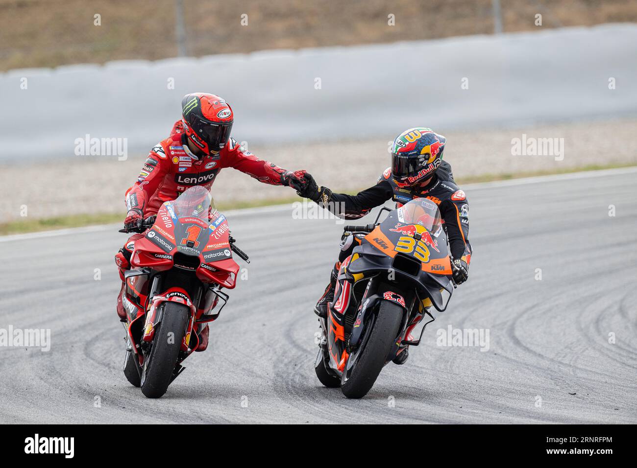 Barcelona, Spain. 2nd Sep, 2023. Pecco Bagnaia (1) of Ducati Team and Brad Binder (33) of Red Bull KTM Factory at the end of the MotoGP Gran Premi Monster Energy de Catalunya Sprint Race, Saturday. 1-2-3 September 2023, at Circuit de Barcelona-Catalunya in Barcelona, Spain. Credit: rosdemora/Alamy Live News Stock Photo