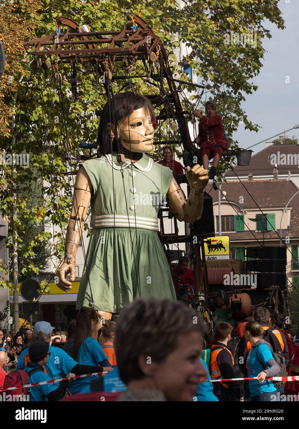 (170929) -- GENEVA, Sept. 29, 2017 -- A giant puppet of a girl, measuring nearly 8 meters, marches on the street of Geneva, Switzerland, Sept. 29, 2017. Two giant puppets of the Royal de Luxe Company, which travels around the world, guest in Geneva from Sept. 29 to Oct. 1. ) (zf) SWITZERLAND-GENEVA-GIANT-PUPPET XuxJinquan PUBLICATIONxNOTxINxCHN Stock Photo