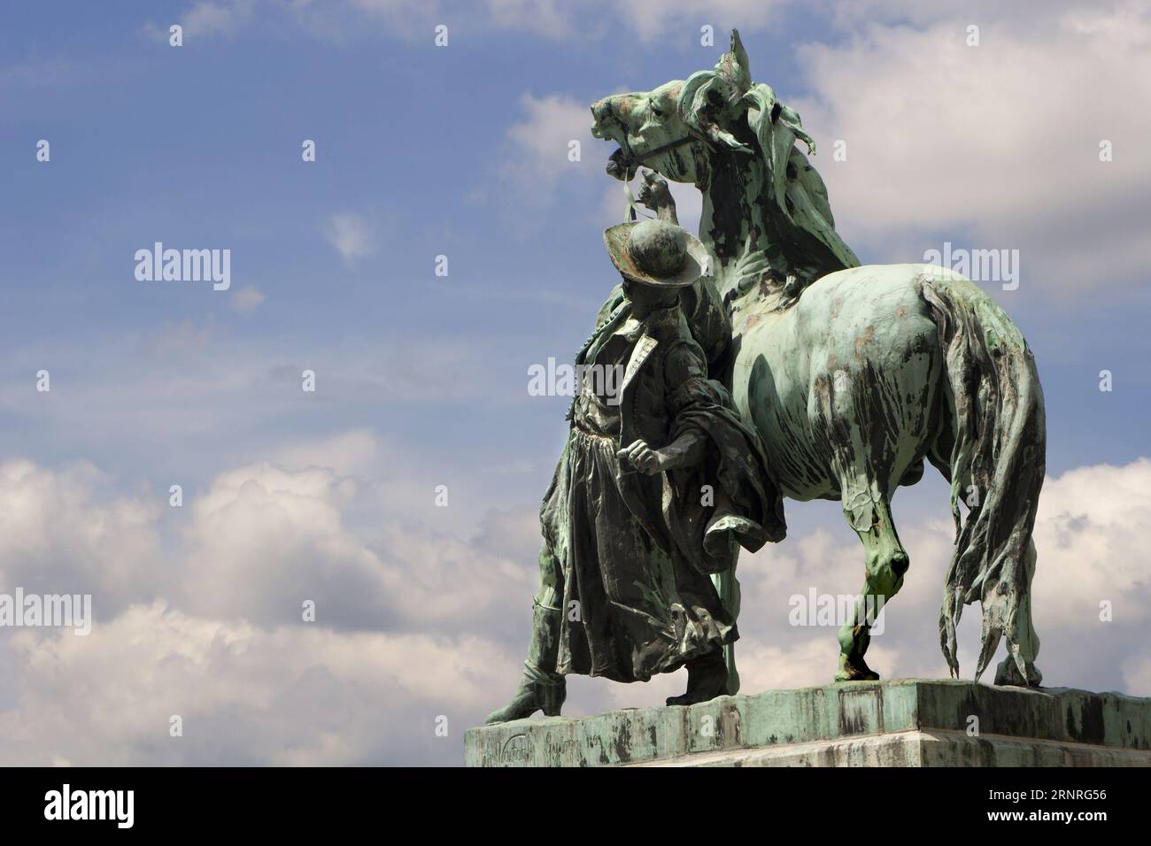 Horse Wrangler - The statue of the Hortobagy ostler - Csikos in the court of Buda castle in Budapest Hungary by György Vastagh Stock Photo