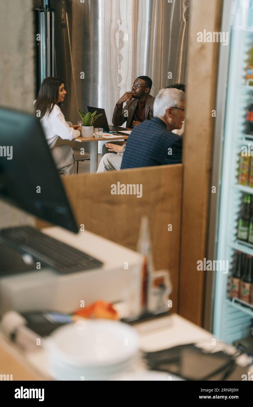 Long distance shot of intergenerational, multiracial group of business