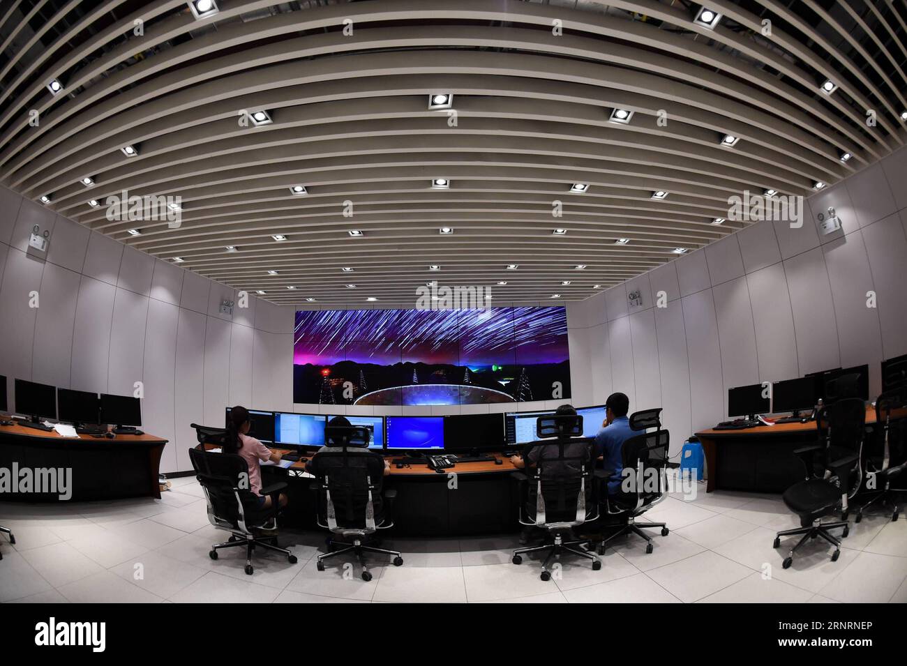 (171010) -- GUIYANG, Oct. 10, 2017 -- Staff members work in the control room of the Five-hundred-meter Aperture Spherical Telescope (FAST) in Pingtang County, southwest China s Guizhou Province, Aug. 9, 2017. The China-based FAST, the world s largest single-dish radio telescope, has identified two pulsars after one year of trial operation, the National Astronomical Observatories of China (NAOC) said on Oct. 10, 2017. ) (ry) CHINA-FAST TELESCOPE-PULSARS (CN) OuxDongqu PUBLICATIONxNOTxINxCHN Stock Photo