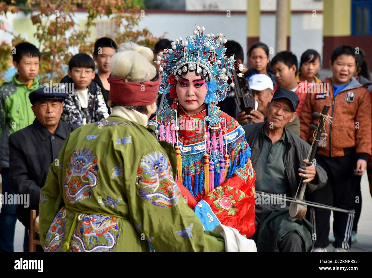 (171013) -- SHIJIAZHUANG, Oct. 13, 2017 -- Actors of Tongle Sixian Troupe perform Sixian, a local opera, at a primary school in Duangu Village of Shijiazhuang City, capital of north China s Hebei Province, Oct. 12, 2017. Actually all actors of the troupe are local villagers, who practise and perform the opera during slack seasons in farming. ) (ry) CHINA-SHIJIAZHUANG-LOCAL OPERA (CN) QiexLei PUBLICATIONxNOTxINxCHN Stock Photo