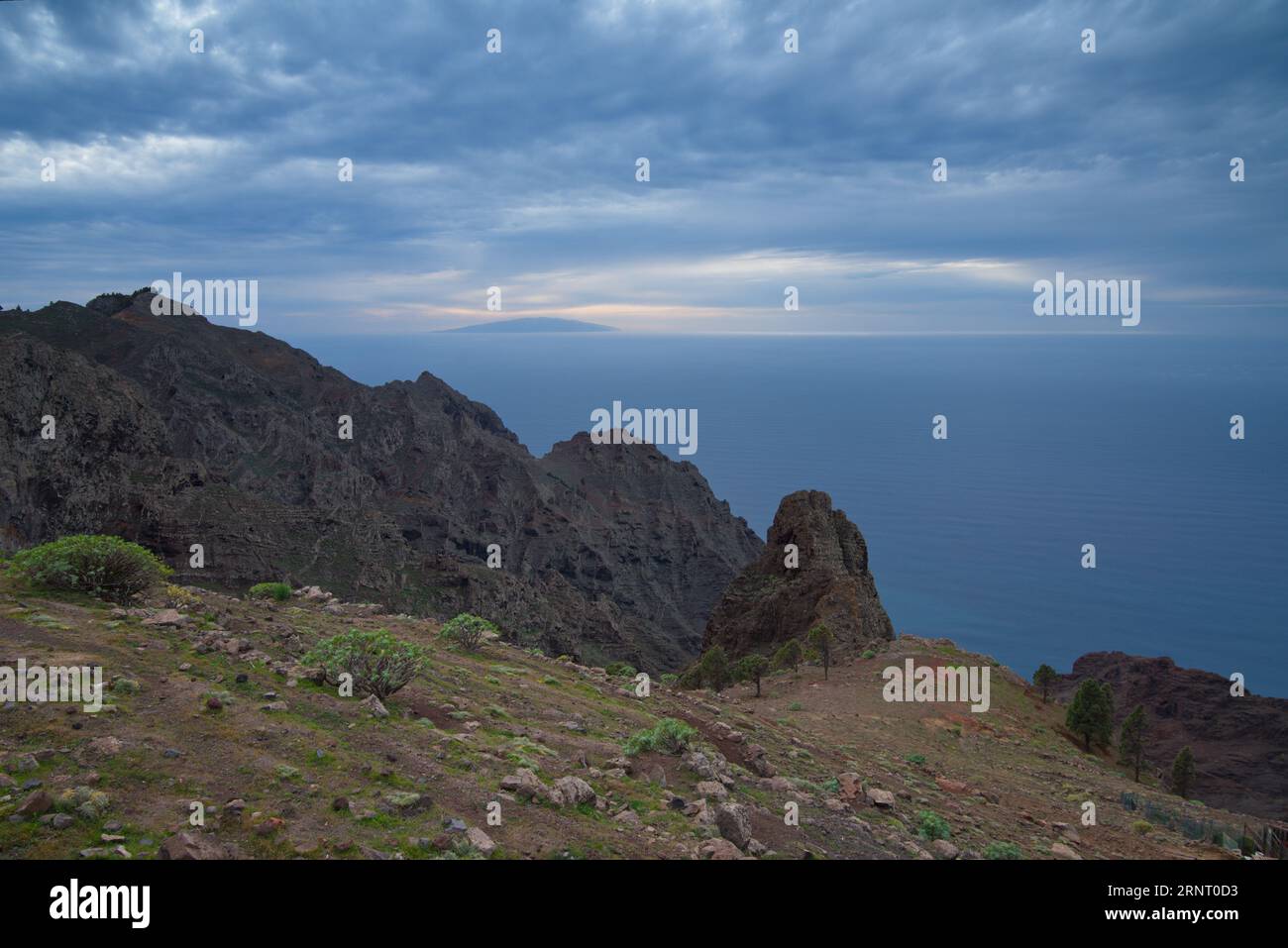 The island of El Hierro in the background seen from the island of La Gomera. La isla de El Hierro al fondo vista desde la isla de La Gomera. Stock Photo