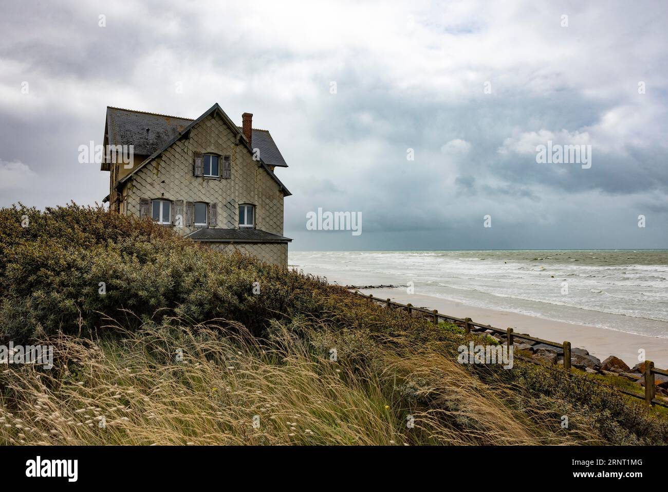 Lonely house by the sea in stormy weather, Portbail, Cotentin, Manche, Normandy, France Stock Photo