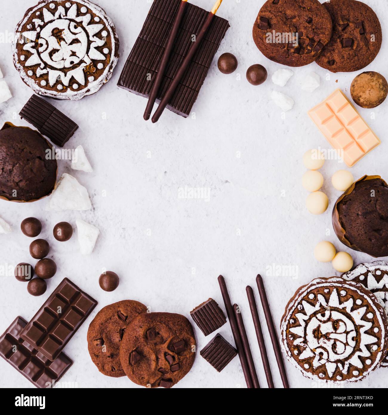 Empty frame made with chocolates products white background Stock Photo