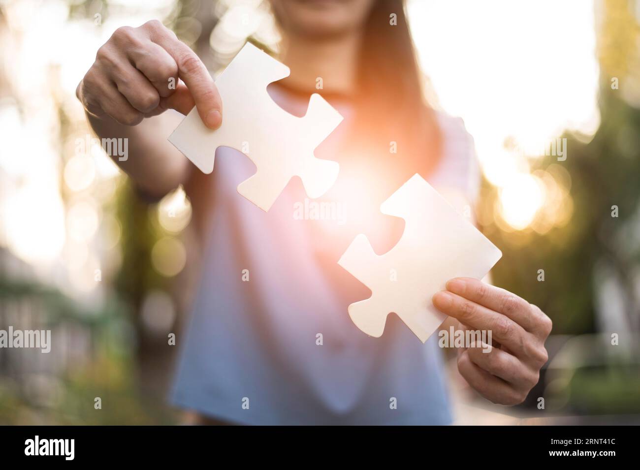 Front view woman holding puzzle pieces Stock Photo