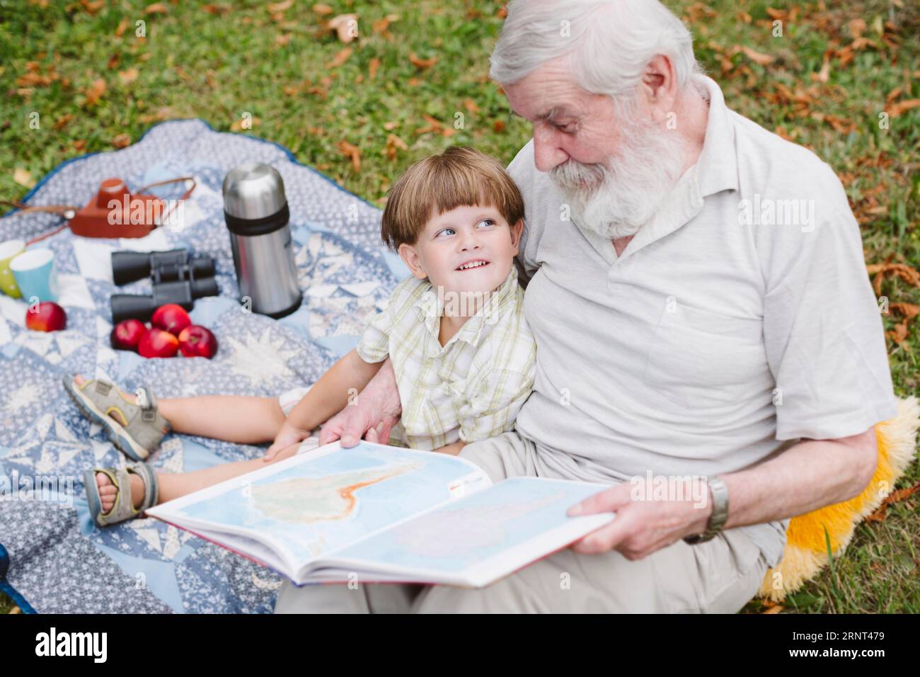 Grandpa reading stories grandson Stock Photo