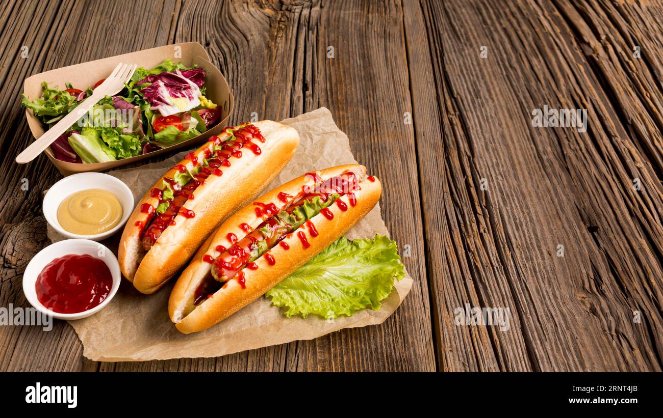 Hot dogs small bowls with spices Stock Photo
