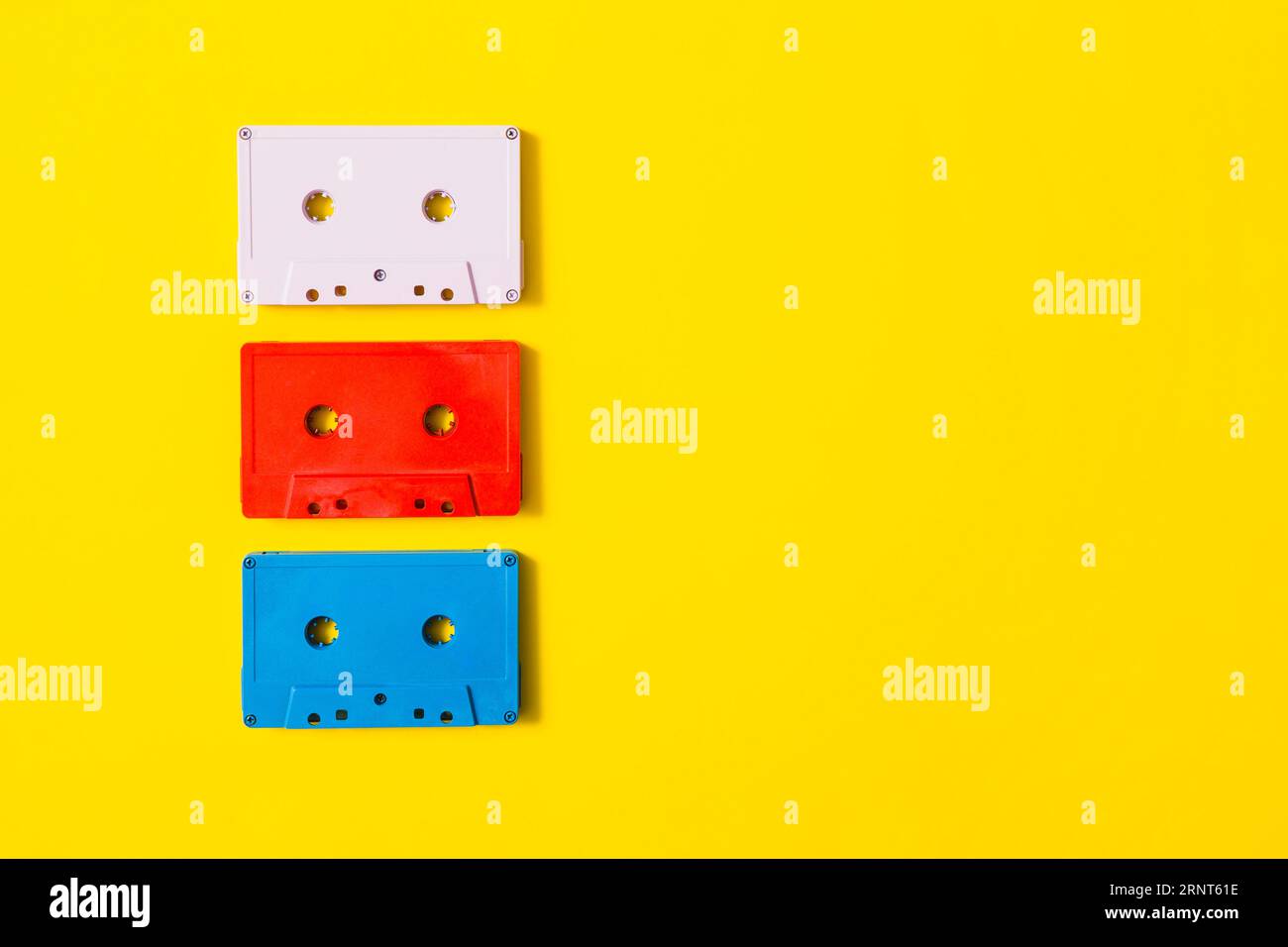 Red white blue audio cassette tape yellow background Stock Photo Alamy