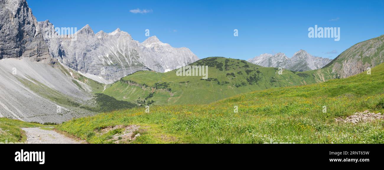 The north walls of Karwendel mountains - look to Brikkarspitze and Kaltwasserspitze peaks with the Falkenhutte chalet. Stock Photo