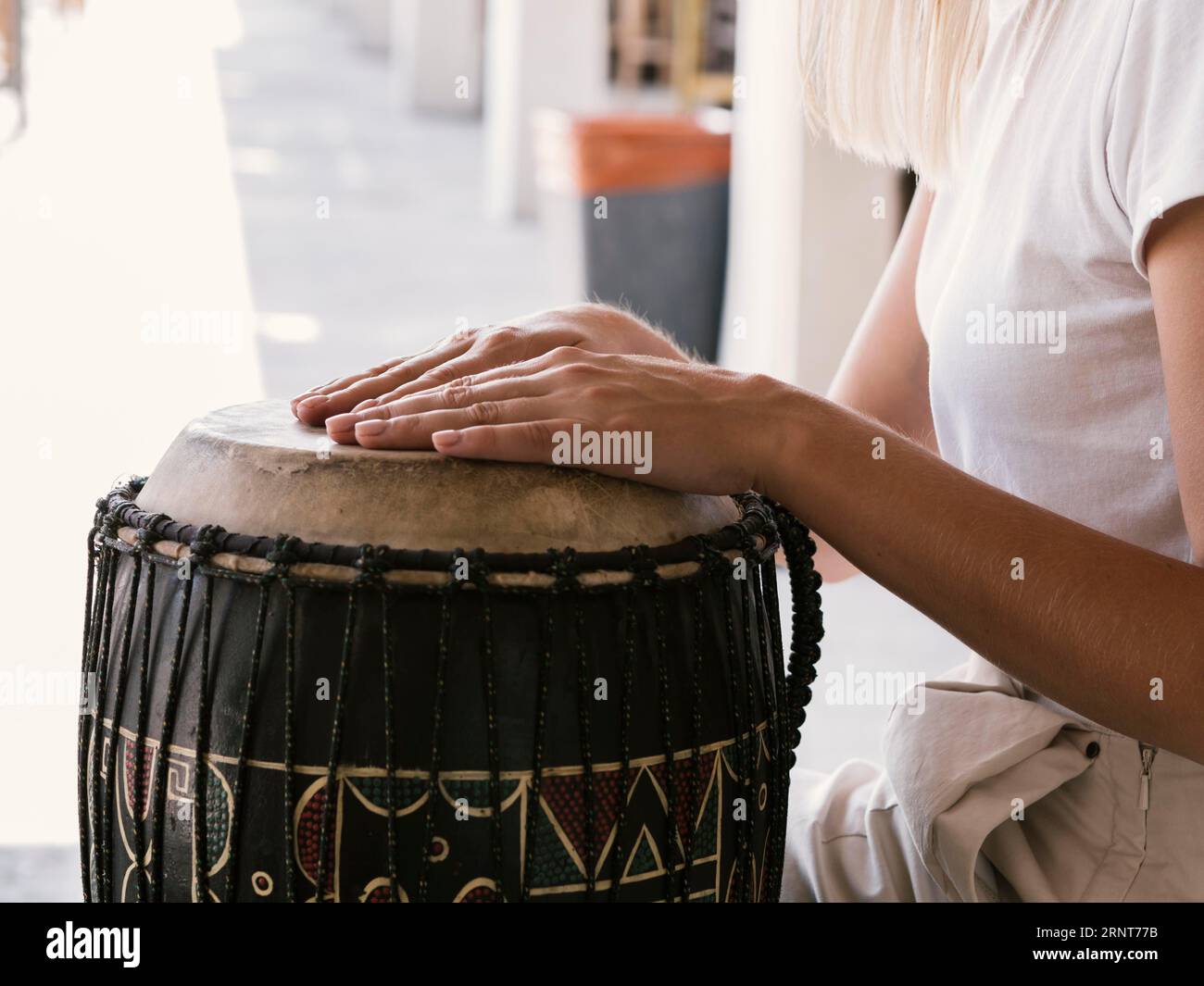 Young person playing latin percussion instrument Stock Photo