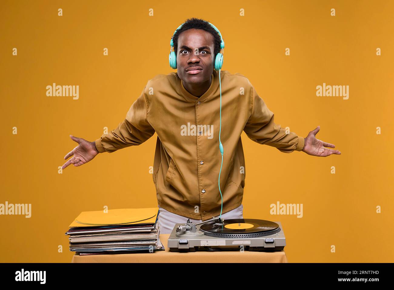 Black man posing with headphones Stock Photo - Alamy